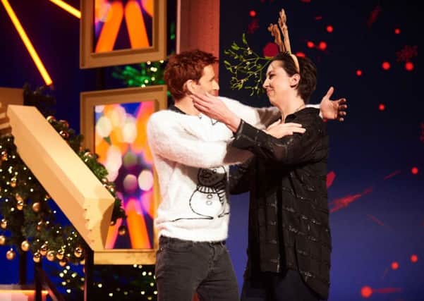 David Tennant kissing Miranda Hart as she presents her Christmas programme Miranda Does Christmas. PIC: PA