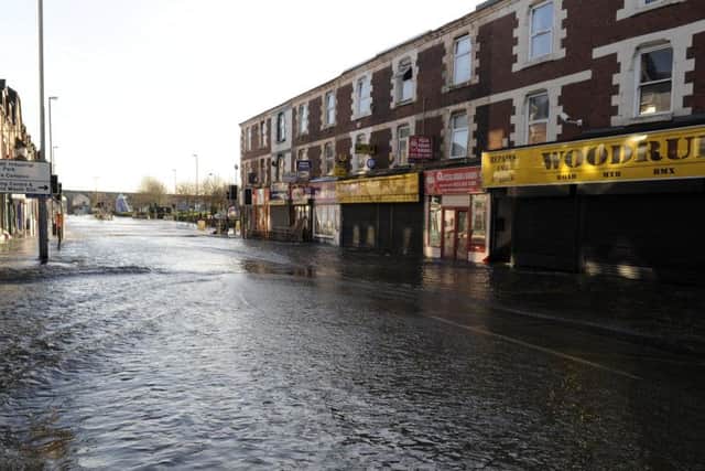 Kirkstall Road shops under water.