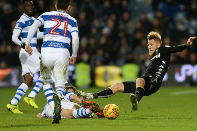 Saiz dives into a tackle during Leeds' win at Queens Park Rangers earlier this month.