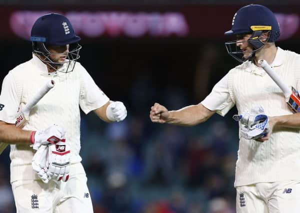 England's Joe Root punches gloves with Chris Woakes. PIC: Jason O'Brien/PA Wire