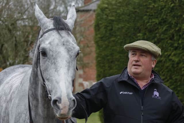 Trainer Paul Nicholls with Politologue. PIC: Julian Herbert/PA Wire
