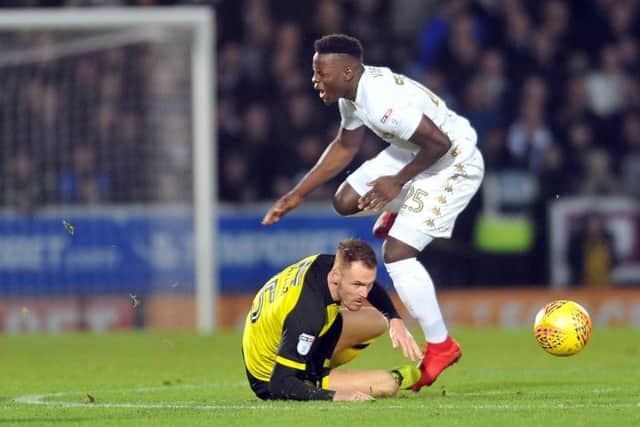 COLLISION: Leeds United's Ronaldo Vieira is caught by a lunge from Burton's Tom Naylor. Picture: Tony Johnson.