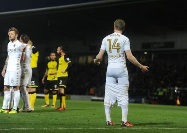 WHAT WAS THAT?! Leeds United's Eunan O'Kane looks bewildered after having his shorts pulled down by Burton Albion goalkeeper Stephen Bywater. Picture by Tony Johnson.