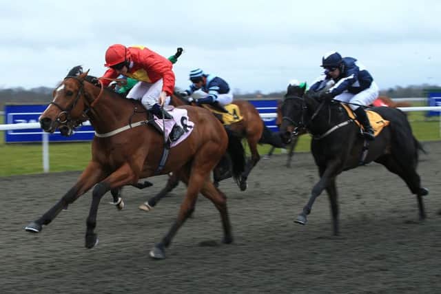 Captain Navarre, ridden jockey Simon Pearce, on the way to winning the High Definition Racing UK Handicap in March last year. PIC: John Walton/PA Wire