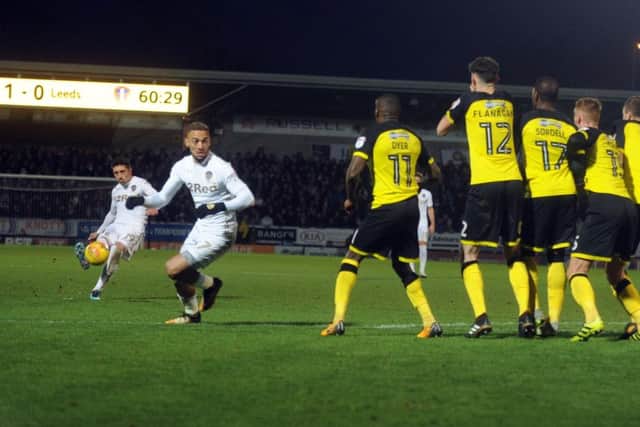 DON'T STOP ME NOW: Pablo Hernandez curls his equaliser around the Burton Albion wall. Picture: Tony Johnson.