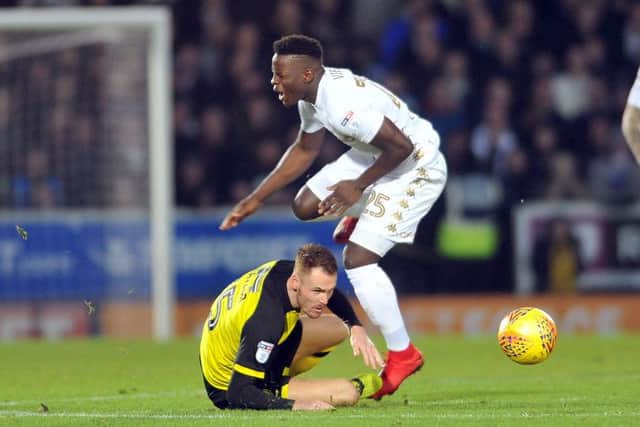 FEEL THE FORCE: Leeds United's Ronaldo Viera is caught by Burton's Tom Naylor. Picture: Tony Johnson.