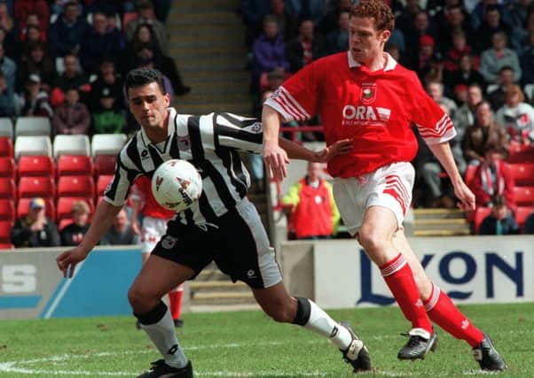 Defending youngsters: Adrian Moses, in his Barnsley days, is now a financial advisor for footballers.