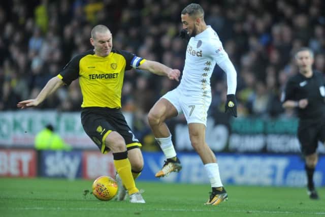 CONFIDENT: Leeds United's Kemar Roofe battles with Burton's Jake Buxton on Boxing Day. Picture: Tony Johnson.