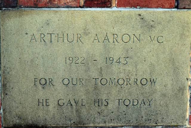The plaque beneath the Arthur Aaron statue.