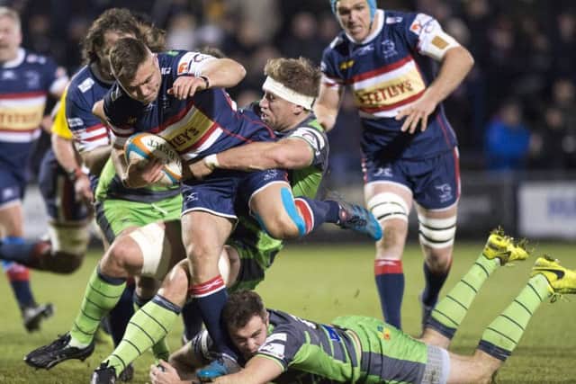 Doncaster's William Owen is tackled by the Yorkshire Carnegie defence.