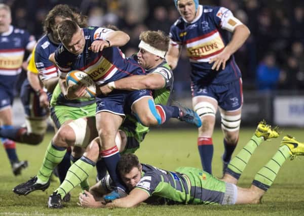 Doncaster's William Owen is tackled by the Yorkshire Carnegie defence.