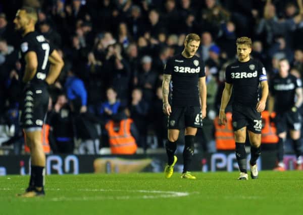 BEATEN: Leeds United's Kemar Roofe, Liam Cooper and captain Gaetano Berardi show their dejection after Birmingham City's winner. Picture by Jonathan Gawthorpe.