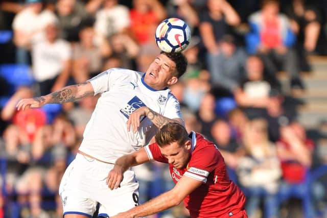 Tranmere's two-goal Andy Cook, left.