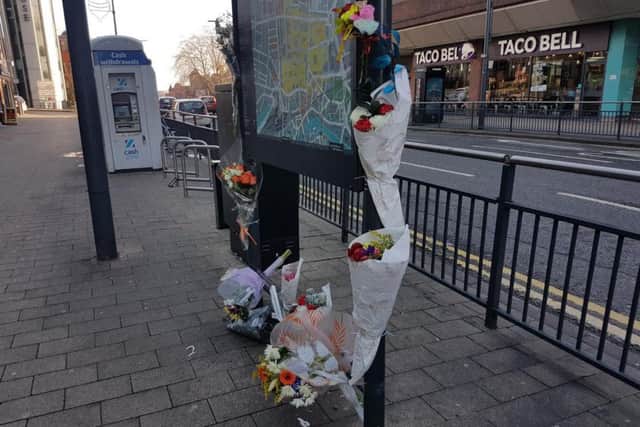 Floral tributes have been laid at the spot where Nigel used to stand