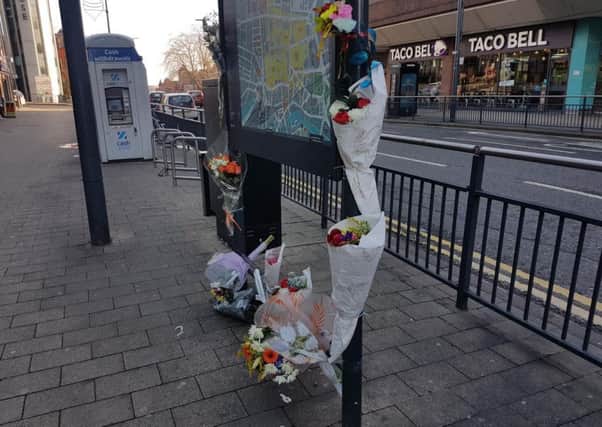 Floral tributes have been laid at the spot where Nigel used to stand
