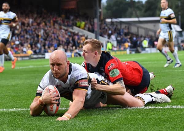 AMBITIOUS: Carl Ablett scores against Featherstone Rovers in last year's Challenge Cup, quarter-final.  Picture: Bruce Rollinson