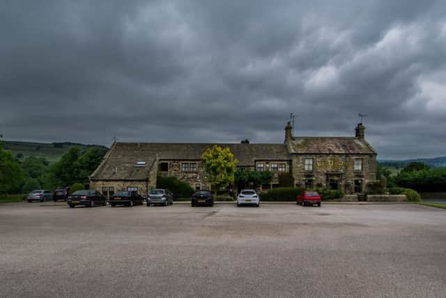 COUNTRY VIEW: Brooding skies loom over the sprawling Wellington Inn, near Harrogate.