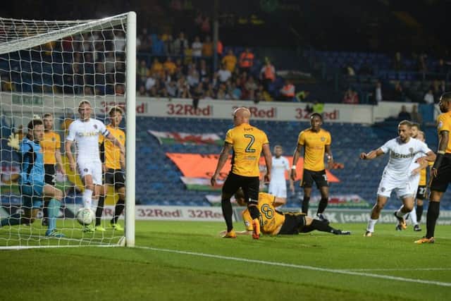 Kemar Roofe scores Leeds United's equaliser against Newport County in August.
