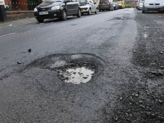 A stock photo of a pothole
