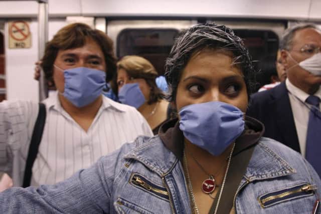 People wore surgical masks as a precaution against infection from flu in Mexico City in 2009. (Pictures: PA).