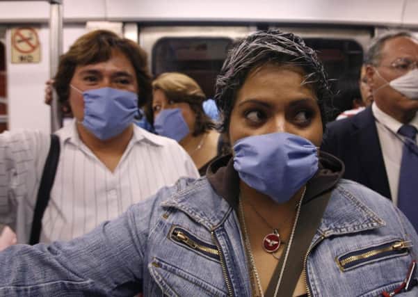 People wore surgical masks as a precaution against infection from flu in Mexico City in 2009. (Pictures: PA).