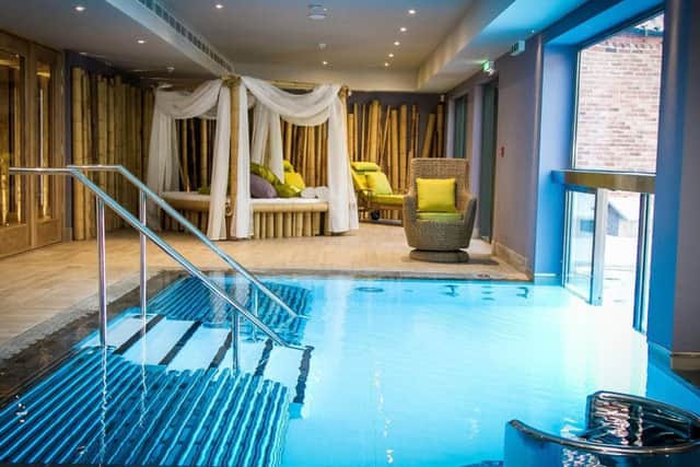 Inside the thermal area. Relax beside the vitality pool on a four-poster lounging bed