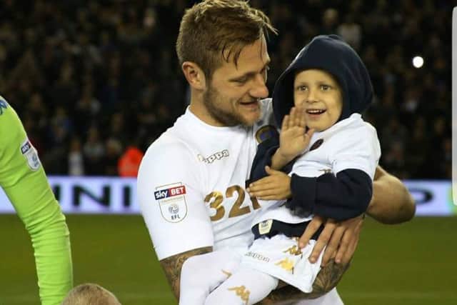 Toby pictured with Leeds United player Liam Cooper