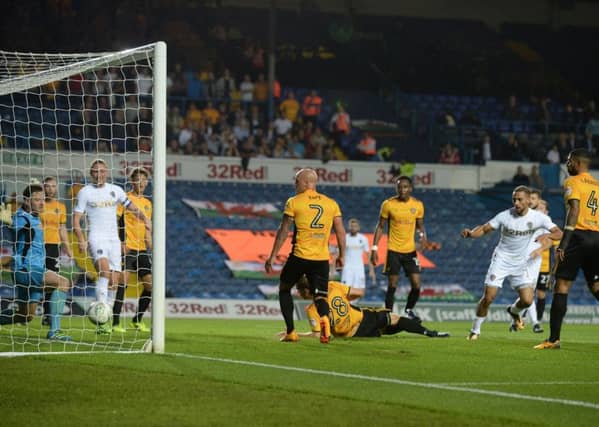 Kemar Roofe scores one of his three goals against Newport County in the Carabao Cup back in August.