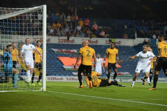 Kemar Roofe scores one of his three goals against Newport County in the Carabao Cup back in August.