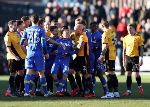 Tempers flare between the two sides resulting in Leeds United's Samuel Saiz (no. 21) being sent off during the Emirates FA Cup third-round match at Rodney Parade. PIC: David Davies/PA Wire