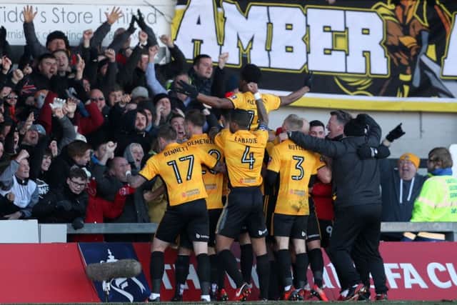 Newport County's Shawn McCoulsky (centre) celebrates scoring his side's winner