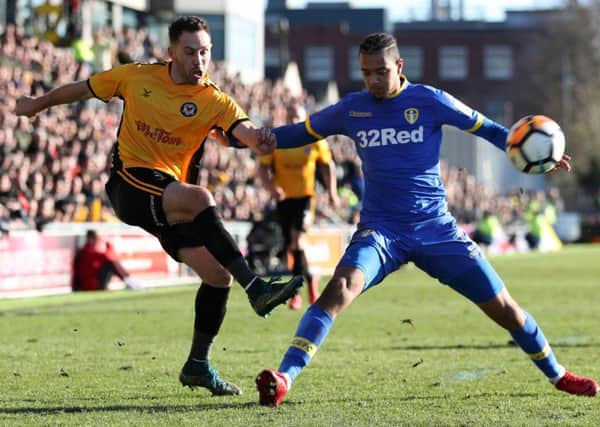 DISAPPOINTING: Manchester United loanee Cameron Borthwick-Jackson, right, was given a rare start for Leeds United at Newport County but the defender, pictured challenging Robbie Willmott, failed to make a positive impact. Picture by James Hardisty,