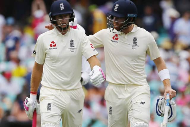 End of the tour: England's Joe Root and Jonny Bairstow walk off at lunch with the captain unable to resume after the break due to illness.