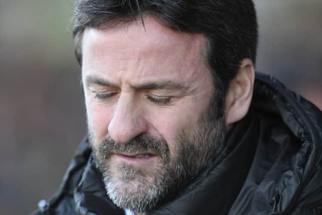 DOWN AND OUT: Leeds United head coach Thomas Christiansen on the touchline at Newport County. Picture James Hardisty.