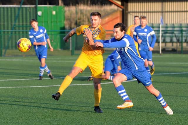 Riley Wilkinson, of Garforth Crusaders, and Morley Town Reserves' Ash Slater battle for possession. PIC: Steve Riding
