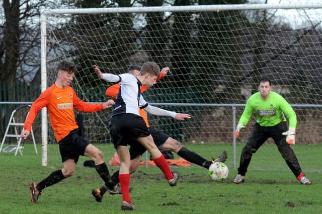 Ryan Clay shoots for Wyke Wanderers against visitors Wetherby Athletic. PIC: Steve Riding