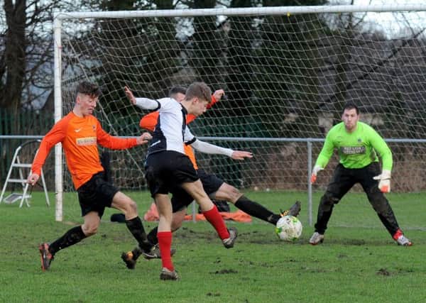 Ryan Clay shoots for Wyke Wanderers against visitors Wetherby Athletic. PIC: Steve Riding