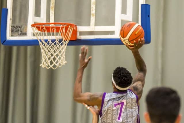 Tavarion Nix drives to the basket against Bristol Flyers.