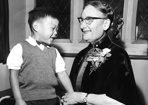 Leeds, 22nd August 1966

Miss Gladys Aylward, the missionary, with her adopted son Gordon, aged four, who was abandoned by his parents in Formosa, Miss Aylward spoke last night at St. George's Church, Leeds, where she described her experiences in China.

BACKGROUND:

Gladys Aylward (Chinese name: , pinyin: Ã i wei dÃ©)
(24 February 1902 - 3 January 1970)
was the Protestant missionary to China whose story was told in the book The Small Woman by Alan Burgess, published in 1957. In 1958, the story was made into the Hollywood film The Inn of the Sixth Happiness, starring Ingrid Bergman.