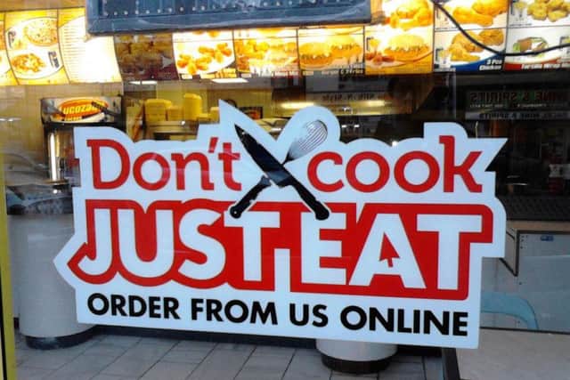 Just Eat is facing criticism for introducing a 50p service fee on all its orders shortly before a ban on card surcharges comes into effect.