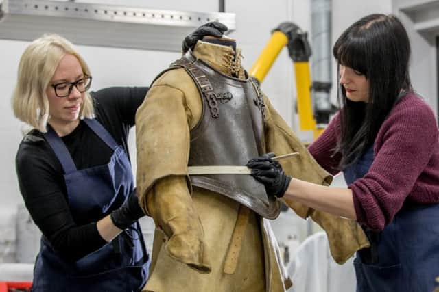 Wednesday 10th January 2018, Leeds UK 
Picture Credit Charlotte Graham 

Picture Shows Breast and back plate and Buff Coat potentially belonging to Colonel Alexander Popham: Royal Armouries Conservators Lauren and Ellie work on a breast and back plate and buff coat, likely to have once belonged to Colonel Alexander Popham, commander in the Parliamentarian army during the English Civil Wars of the 17th-century.