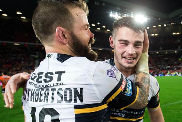 Stevie Ward celebrates with Adam Cuthbertson after the Grand Final victory over Castleford.