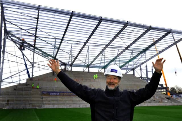 Jonathan Long in front of the work-in-progress South Stand.