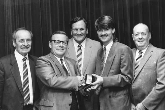 Eric Carlile, Ray Fell and Harry Butler from the Leeds United Supporters' Club with Don Revie and Ian Snodin in 1986.