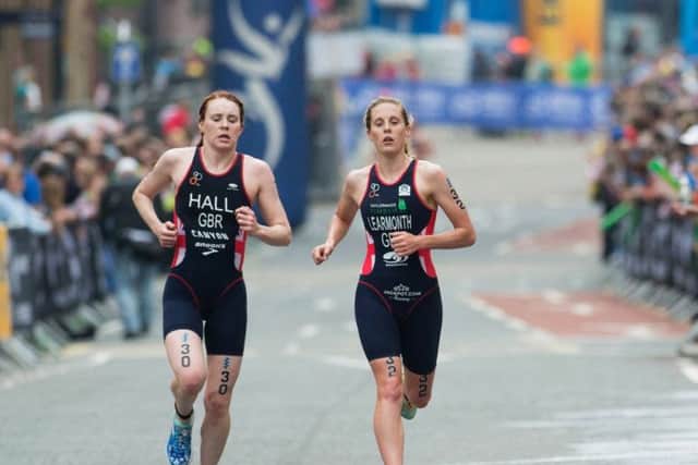 Triathlete Lucy Hall and Jessica Learmonth in action during a triathlon.
