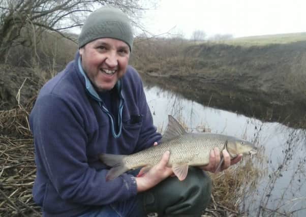 Daz Ratcliffe of Forum AC with a winter barbel that fell to summer tactics from Hammertons Horseshoe Bend on the Nidd.