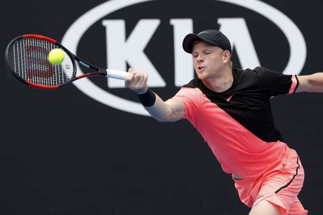 On his way: Britain's Kyle Edmund makes a forehand return to South Africa's Kevin Anderson.