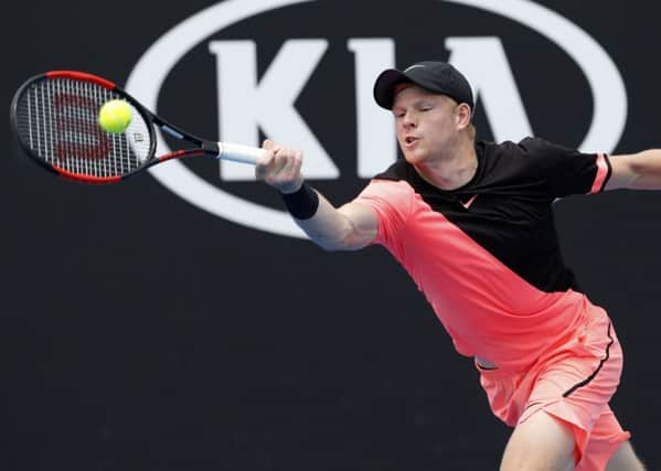 On his way: Britain's Kyle Edmund makes a forehand return to South Africa's Kevin Anderson.