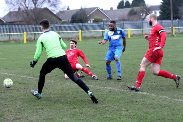 Whitkirk Wanderers' 
Dan Sheriffe strokes the ball home. PIC: Steve Riding
