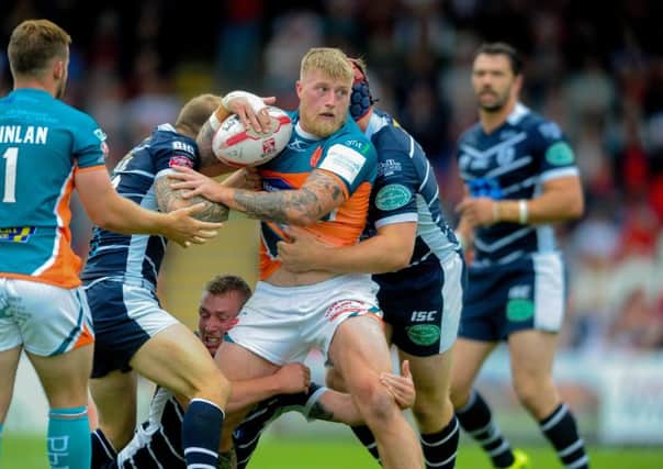TOUGH LOSS: Hull KR's Danny Addy (with ball) battles against Featherstone Rovers last year, but will miss the entire 2018 season. Picture: James Hardisty.